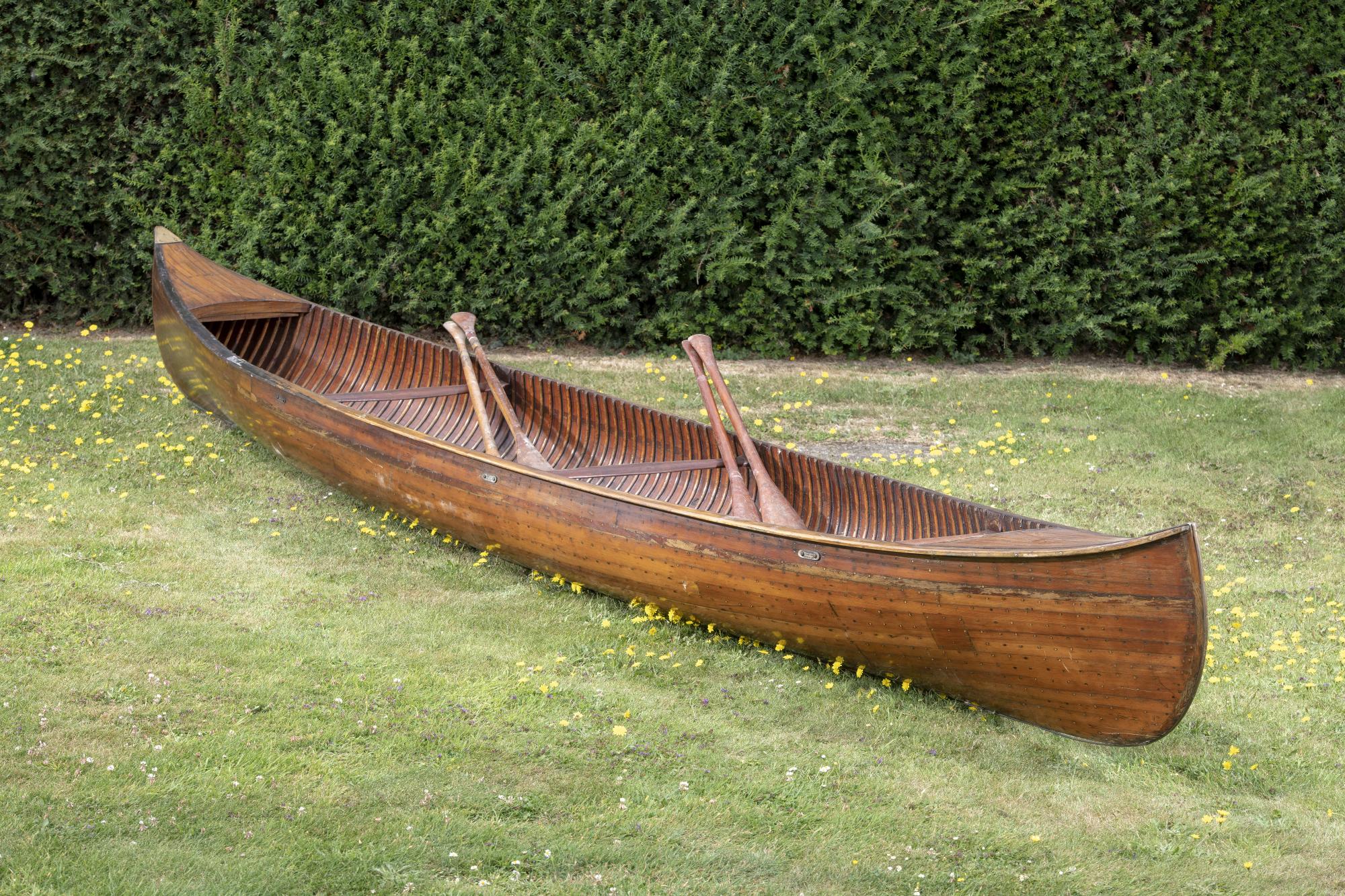Lot 33 Boats A cedar strip canoe by the Lakefield